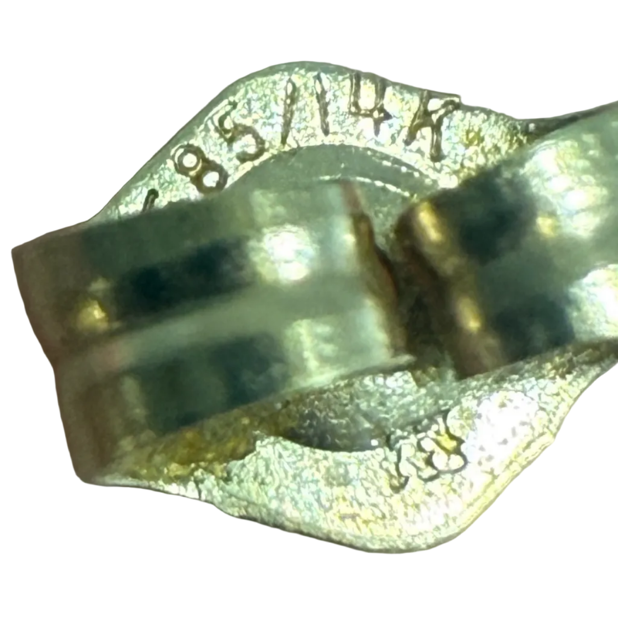 Close-up of the back of a vintage earring showing a 14K gold stamp
