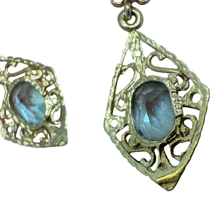 Close-up of the 14K gold stamp on the back of a vintage filigree aquamarine earring