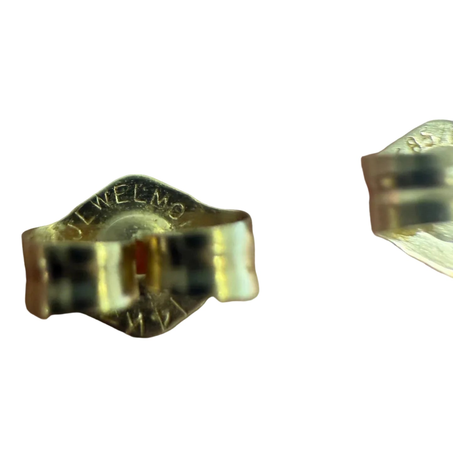 Close-up of the maker’s mark on the back of a vintage 14K gold earring