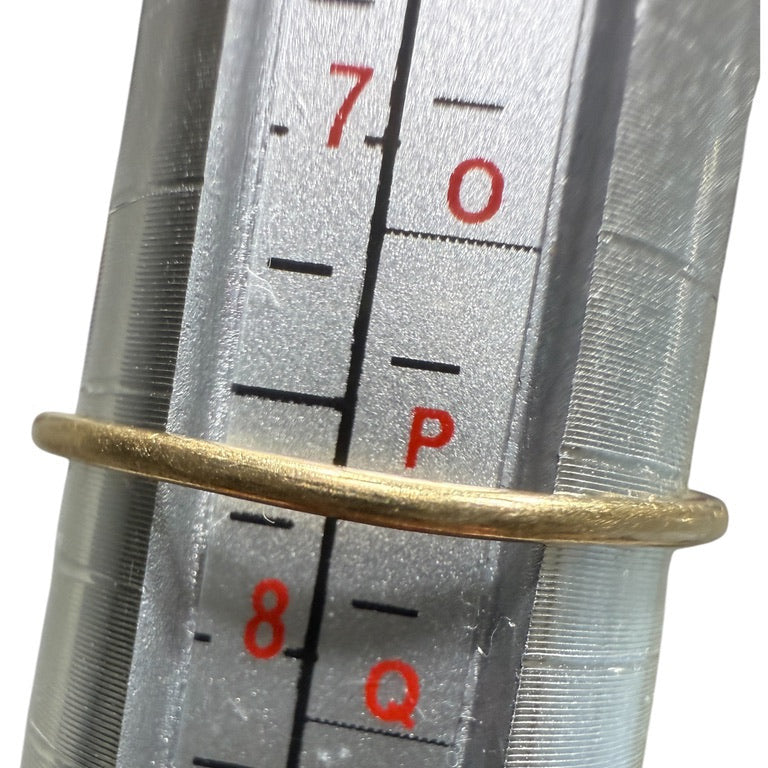 Vintage 10K gold diamond cluster ring shown on a mandrel, measuring size 7.75