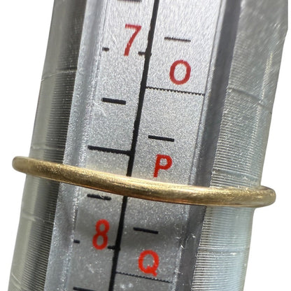 Vintage 10K gold diamond cluster ring shown on a mandrel, measuring size 7.75