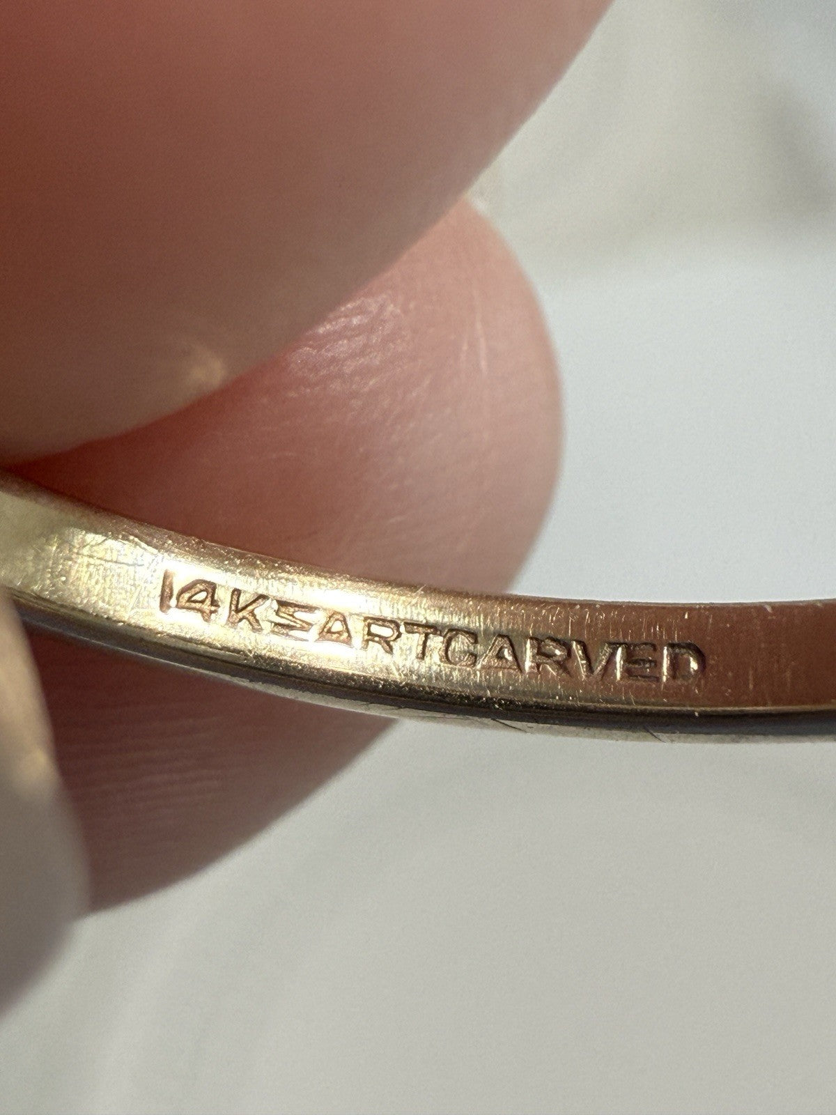 Close-up of 14K ArtCarved hallmark stamped inside vintage 1930s Art Deco two-tone diamond ring
