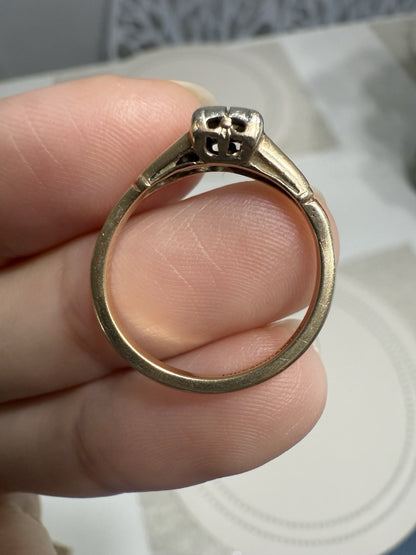 Side profile of 1930s Art Deco ArtCarved 14K two-tone diamond ring showing illusion head and open gallery design