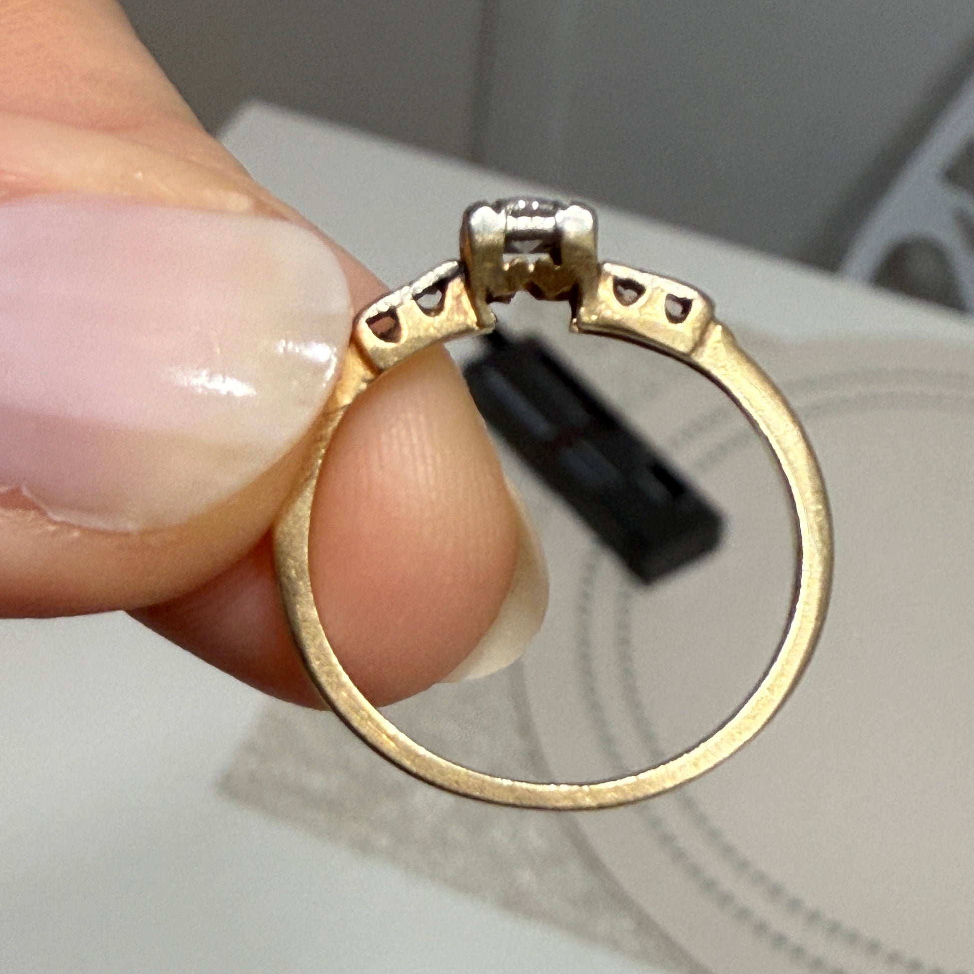 Underside view of 1940s vintage 14K two-tone diamond engagement ring, showing handmade openwork gallery details and craftsmanship.