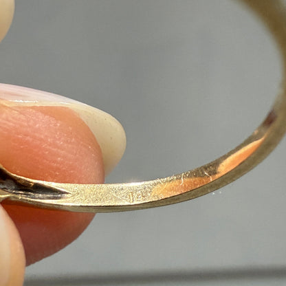 Close-up of faint 14K gold hallmark inside 1940s vintage two-tone diamond engagement ring band.
