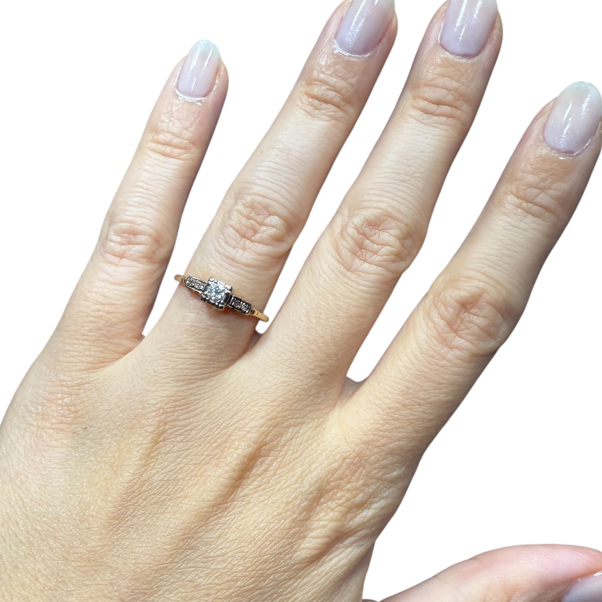 1940s vintage 14K two-tone diamond engagement ring with illusion head and stepped shoulders, shown worn on hand for scale (size 5.5)
