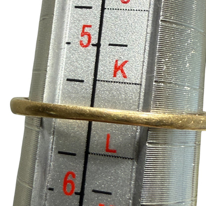 Ring mandrel measurement showing 1940s vintage 14K two-tone diamond engagement ring at size 5.5.