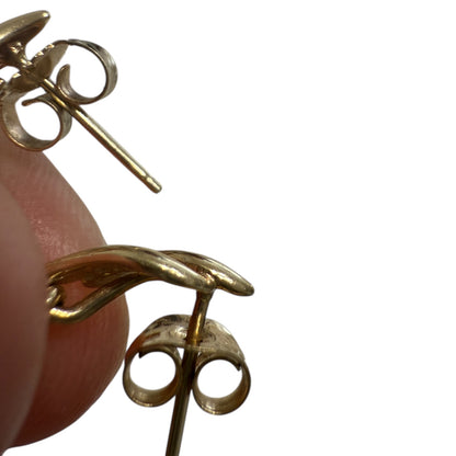 Back view of 1990s vintage 10K yellow gold emerald and diamond dangle earrings showing post and butterfly backing