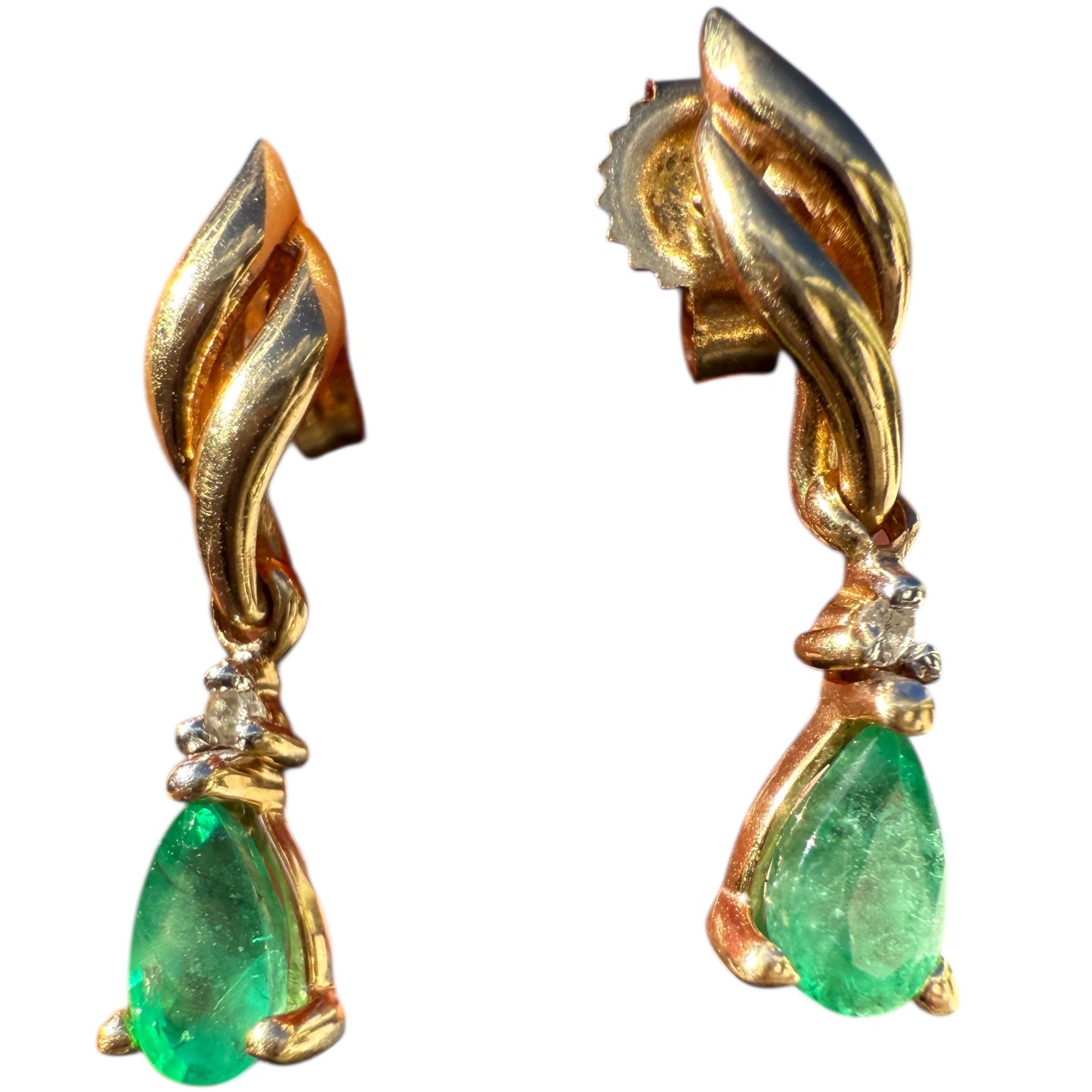 Pair of 1990s vintage 10K yellow gold emerald and diamond dangle earrings on white background