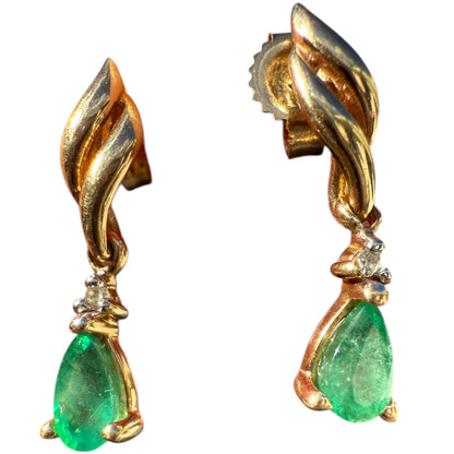 Pair of 1990s vintage 10K yellow gold emerald and diamond dangle earrings on white background