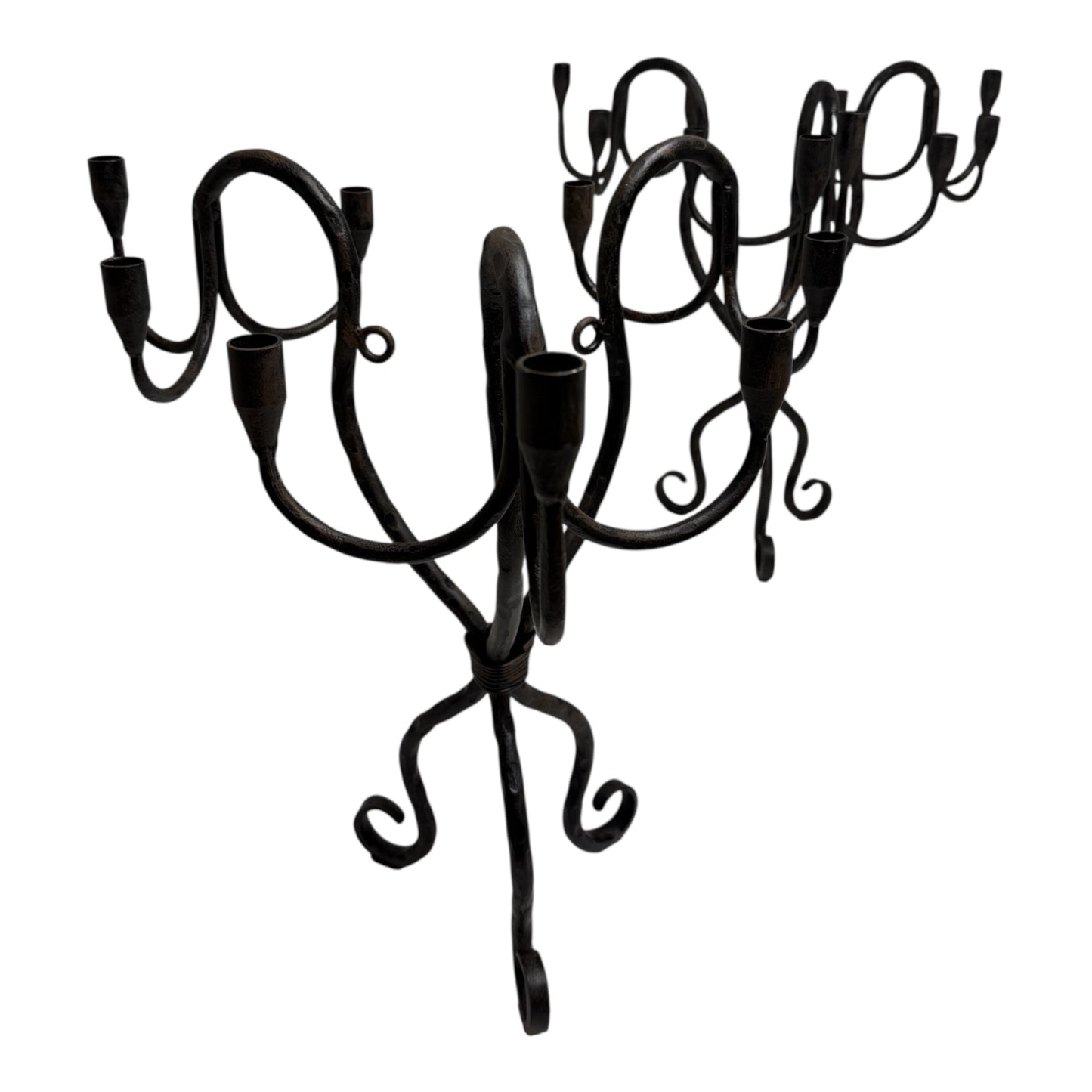 Vintage hand-wrought iron candelabra with scrolling forged arms and dark patina, photographed on a white background.