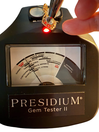 Vintage 14K gold aquamarine earring being tested on a Presidium Gem Tester II showing gemstone reaction