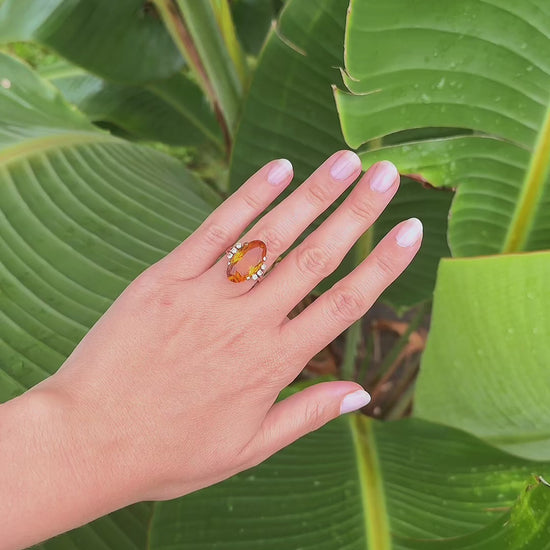 Video of vintage 1950s 14K gold oval citrine and diamond cocktail ring worn on hand outdoors