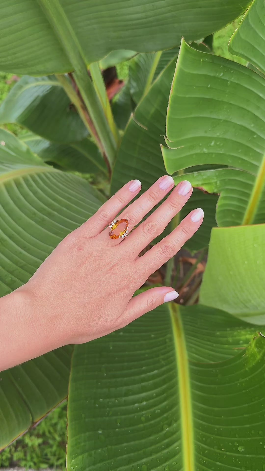 Video of vintage 1950s 14K gold oval citrine and diamond cocktail ring worn on hand outdoors