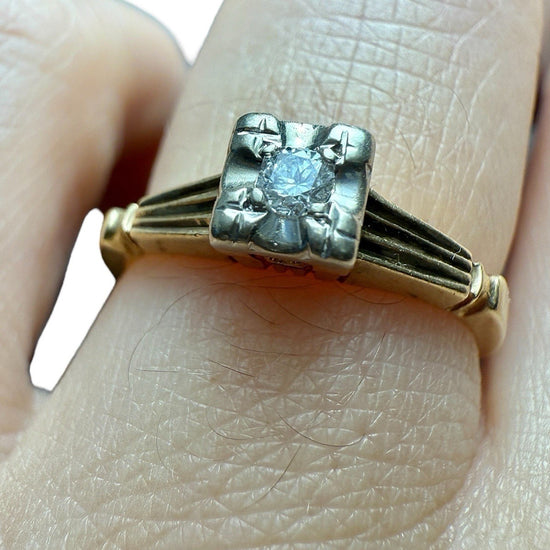 Close-up video of a vintage 14K gold diamond illusion head ring