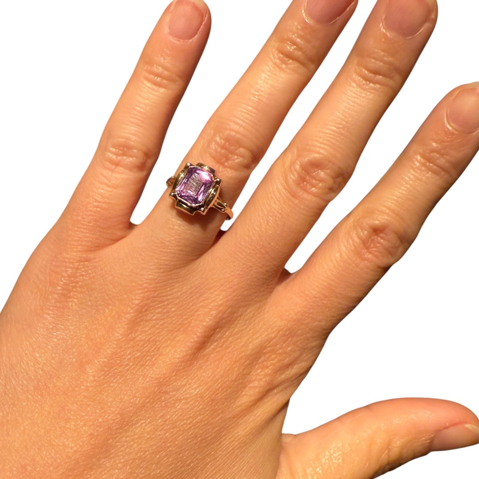 Video showcasing a 1950s Mid-Century 10K gold ring with a lavender amethyst gemstone, worn on a hand with movement to highlight sparkle and detail.