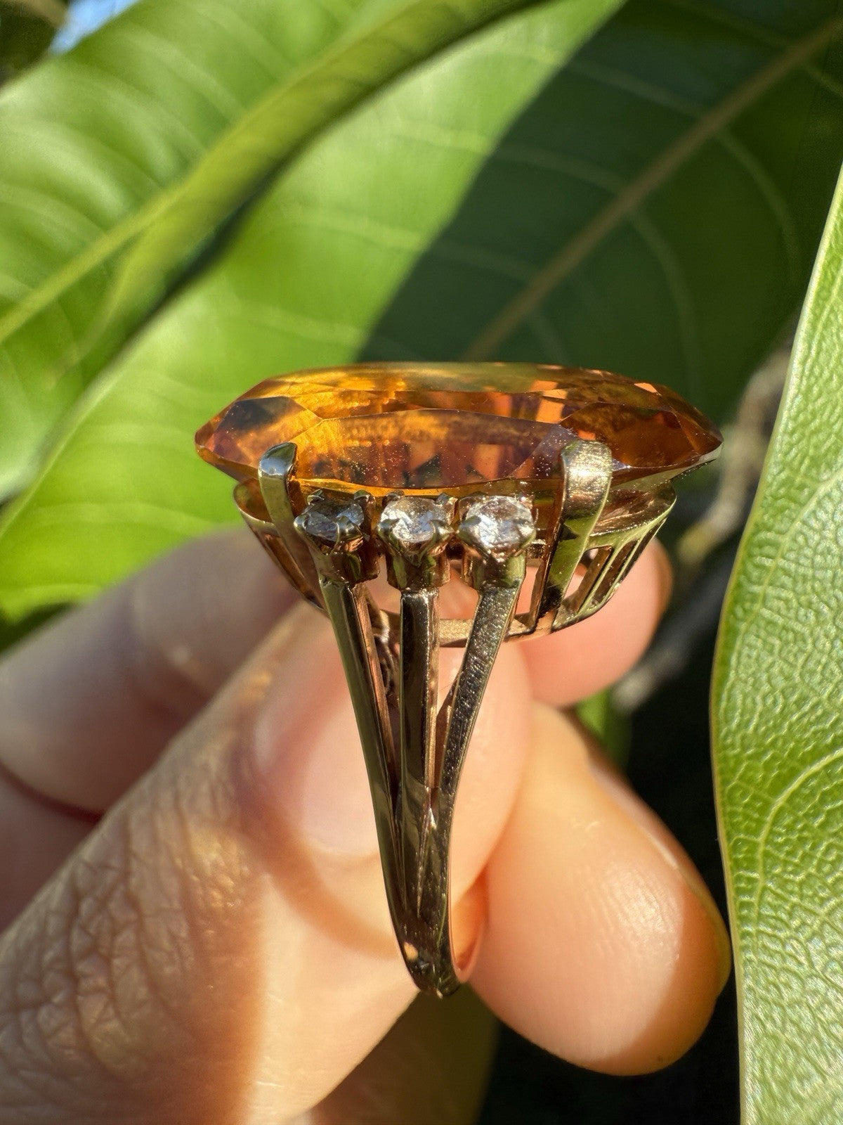 Side view of vintage 1950s 14K gold citrine and diamond cocktail ring showing prong setting and gemstone height