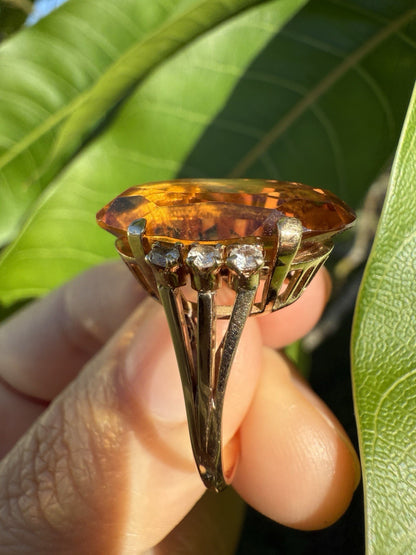 Side view of vintage 1950s 14K gold citrine and diamond cocktail ring showing prong setting and gemstone height