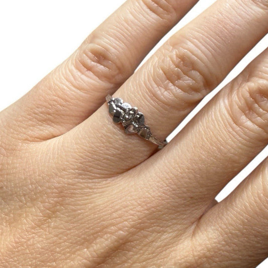 1950s vintage 10K white gold twig band illusion marquise diamond ring on hand, size 5.75