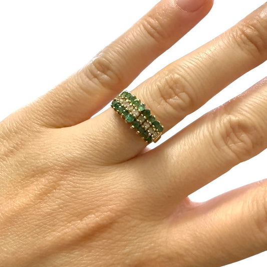 Vintage 1970s 14K yellow gold emerald and diamond cocktail cluster ring on hand, size 5.75