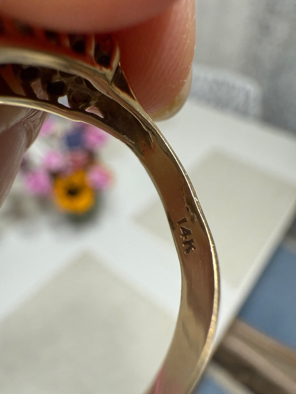 Inside band view of vintage 14K yellow gold emerald and diamond cocktail ring showing 14K hallmark stamp