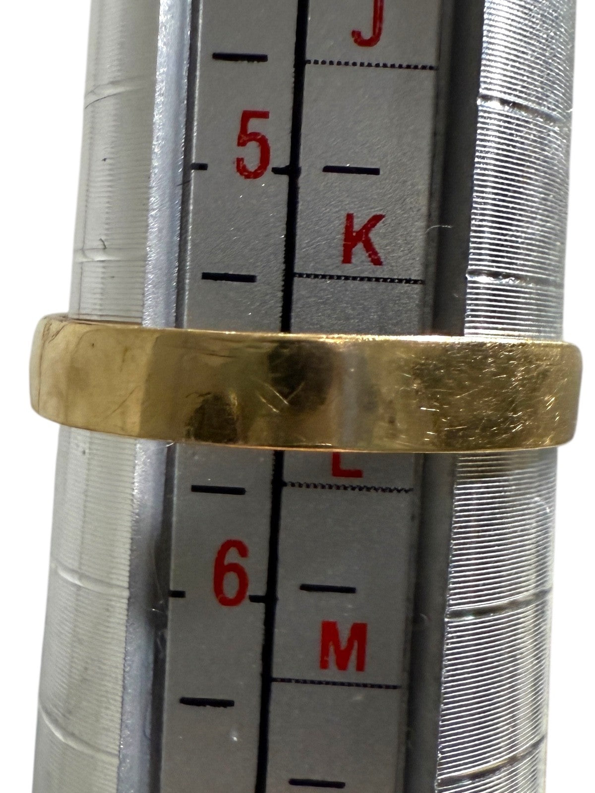 Vintage 14K yellow gold emerald and diamond pyramid cocktail ring measured on ring mandrel showing size 5.75