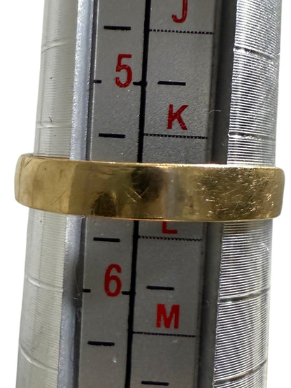 Vintage 14K yellow gold emerald and diamond pyramid cocktail ring measured on ring mandrel showing size 5.75