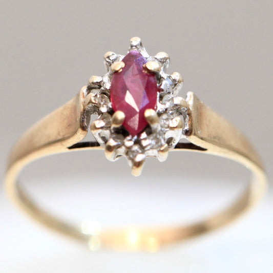 1970s vintage 10K gold ruby and diamond halo ring, marquise cut ruby, size 5.75