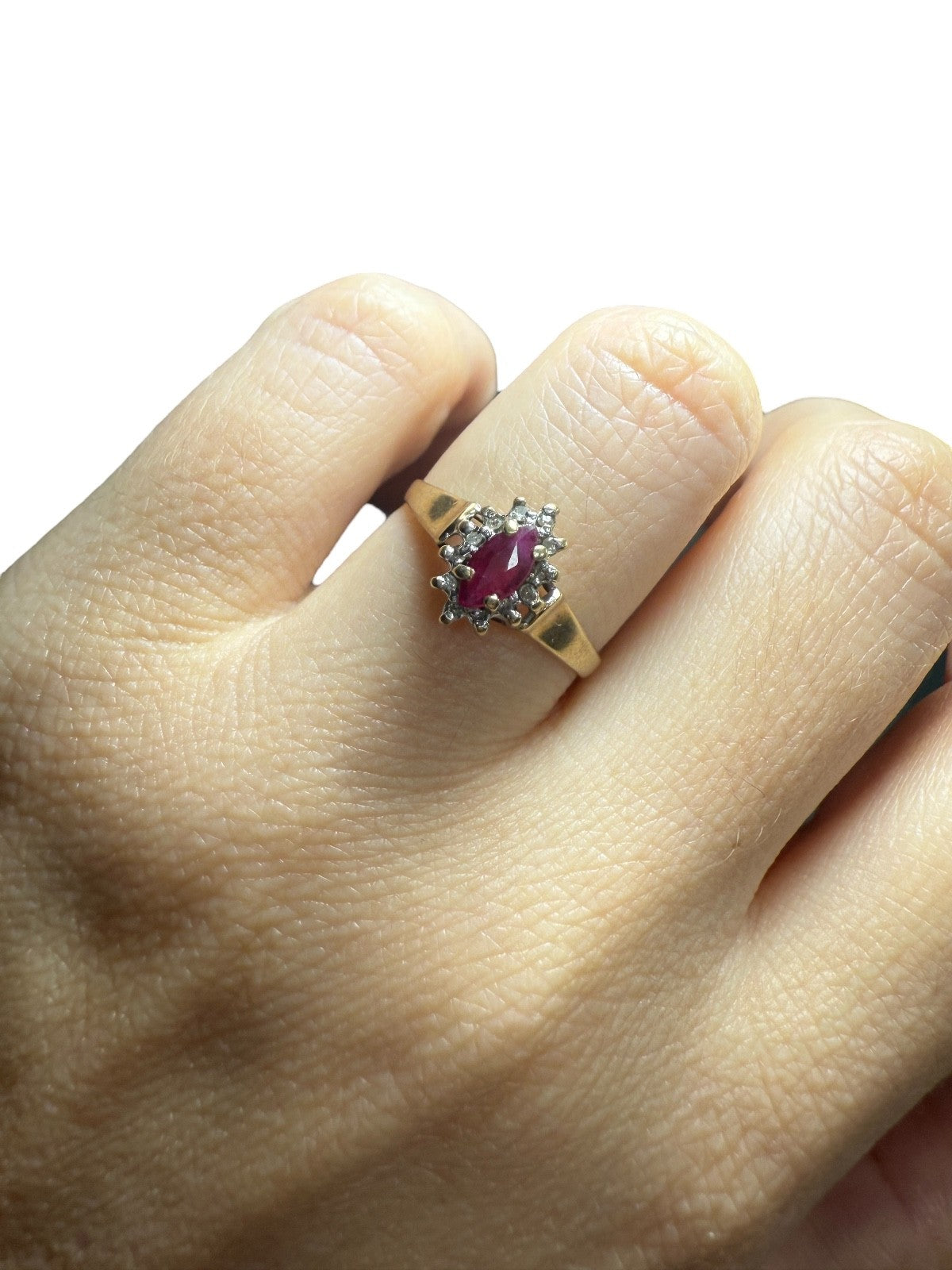 1970s vintage 10K gold ruby and diamond halo ring, marquise cut, size 5.75, shown worn on hand