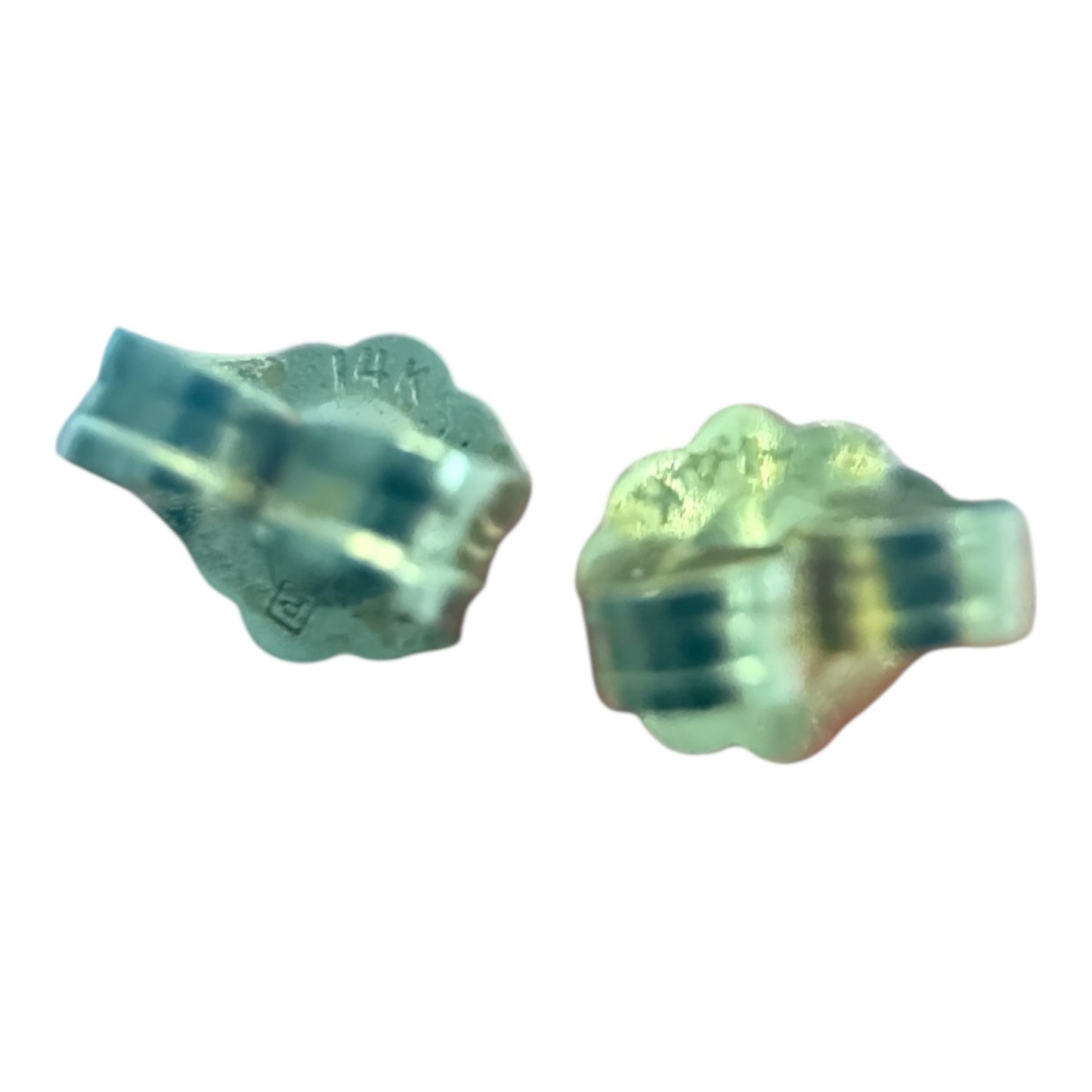 Close-up of a vintage 1960s 14k gold filigree pearl flower stud earring on a white background