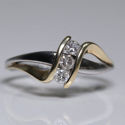 1970s vintage 10K two tone gold diamond bypass ring with three round diamonds
