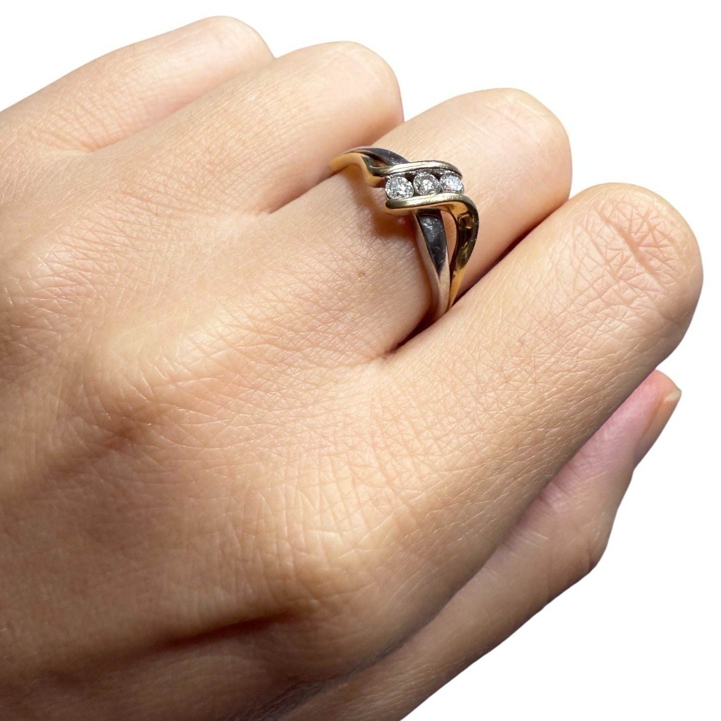 1970s vintage 10K two tone gold diamond bypass ring worn on hand