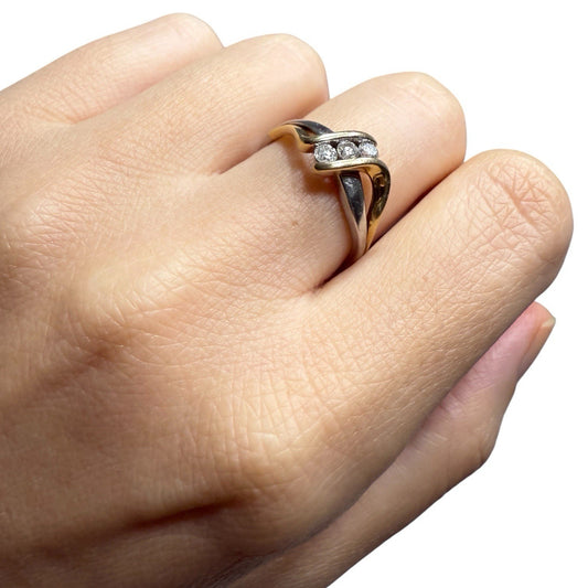 1970s vintage 10K two tone gold diamond bypass ring worn on hand