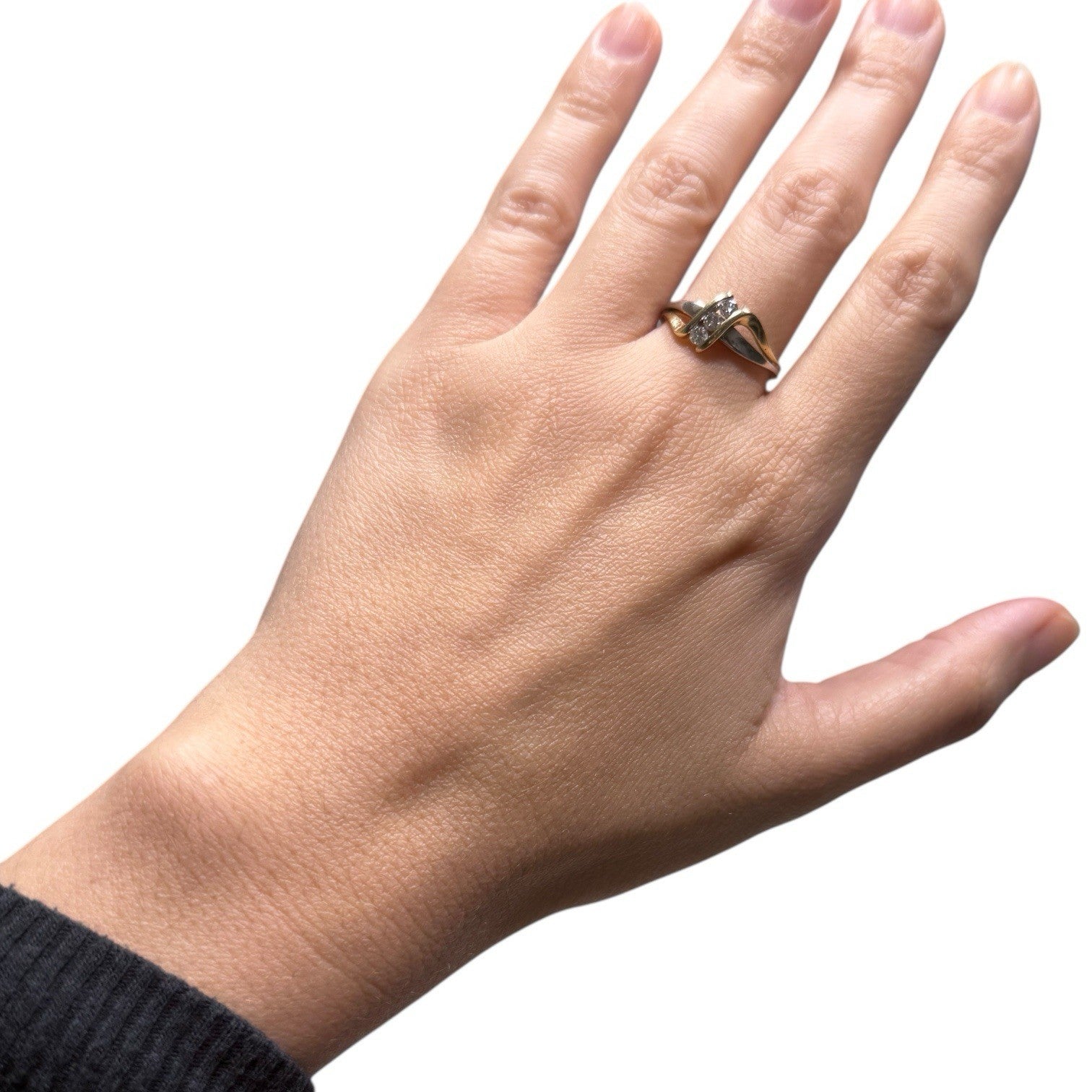 1970s vintage 10K two tone gold diamond bypass ring shown on hand