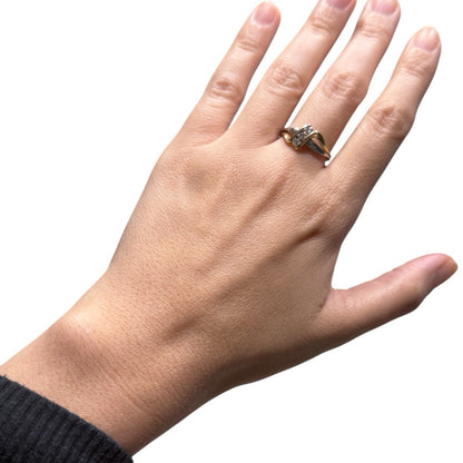 1970s vintage 10K two tone gold diamond bypass ring shown on hand