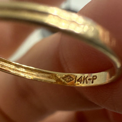 Close-up of 14K gold hallmark stamped inside antique Edwardian oval signet ring band