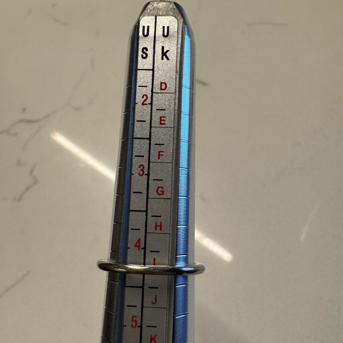 Ring shown on a US ring mandrel indicating approximately size 4.25