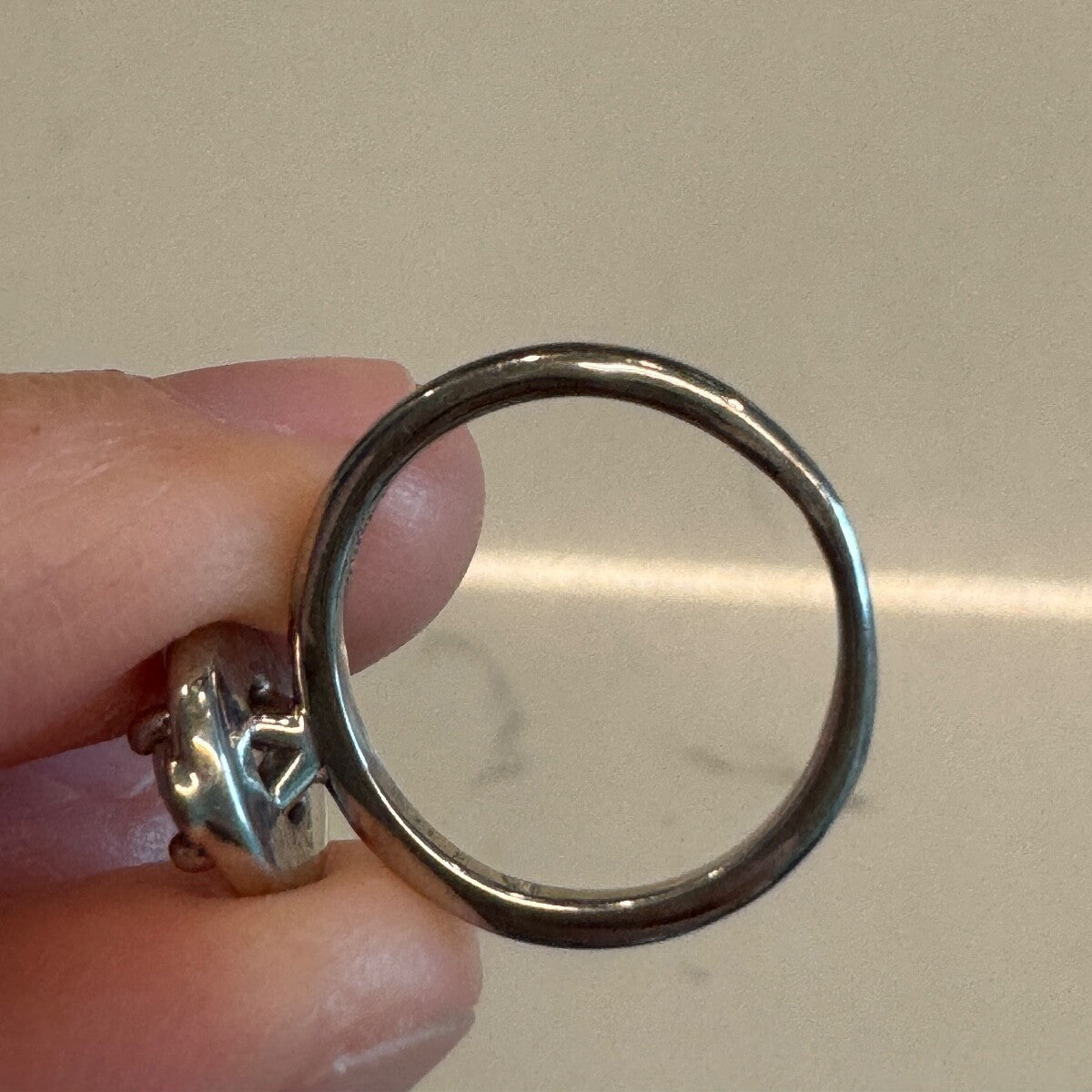Rear view of the 18K white gold diamond ring band showing smooth circular shank